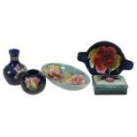 Five Moorcroft items,   comprising: Hibiscus, a circular ashtray with twin rests, impressed mark,