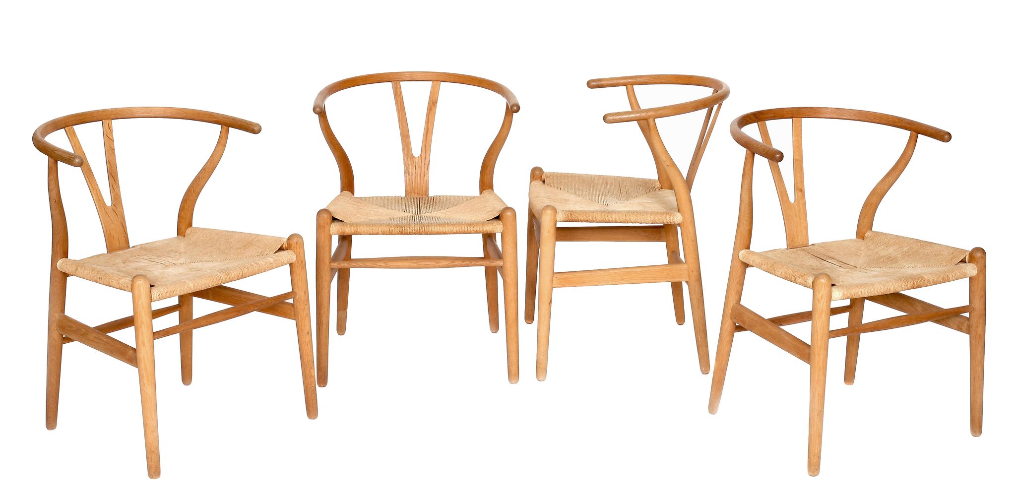 Hans Wegner for Fritz Hansen, a set of four CH24 Wishbone chairs,   designed 1949, ash and paper