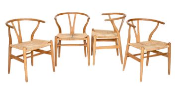 Hans Wegner for Fritz Hansen, a set of four CH24 Wishbone chairs,   designed 1949, ash and paper