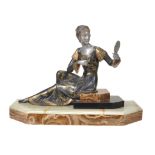 A French Art Deco spelter figure of a seated lady with mirror,   circa 1930, patinated, silvered