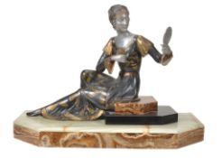 A French Art Deco spelter figure of a seated lady with mirror,   circa 1930, patinated, silvered