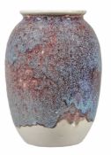 A Ruskin Pottery high fired ovoid vase,   in a flambe red, deep amethyst and blue speckled with