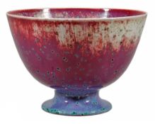 A Ruskin Pottery high fired footed bowl,   in a flambe red glaze with lavender tone and green glaze