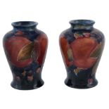 Pomegranate, a pair of Moorcroft small baluster vases,   impressed marks, green painted initials,