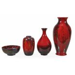 Four pieces of Royal Doulton flambe,   comprising: two veined flambe vases, the taller with a