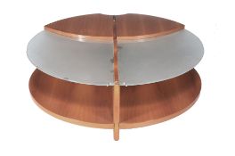 Jaime Tresserra Clapes (b. 1943), a walnut and glass circular coffee table,   with two curved