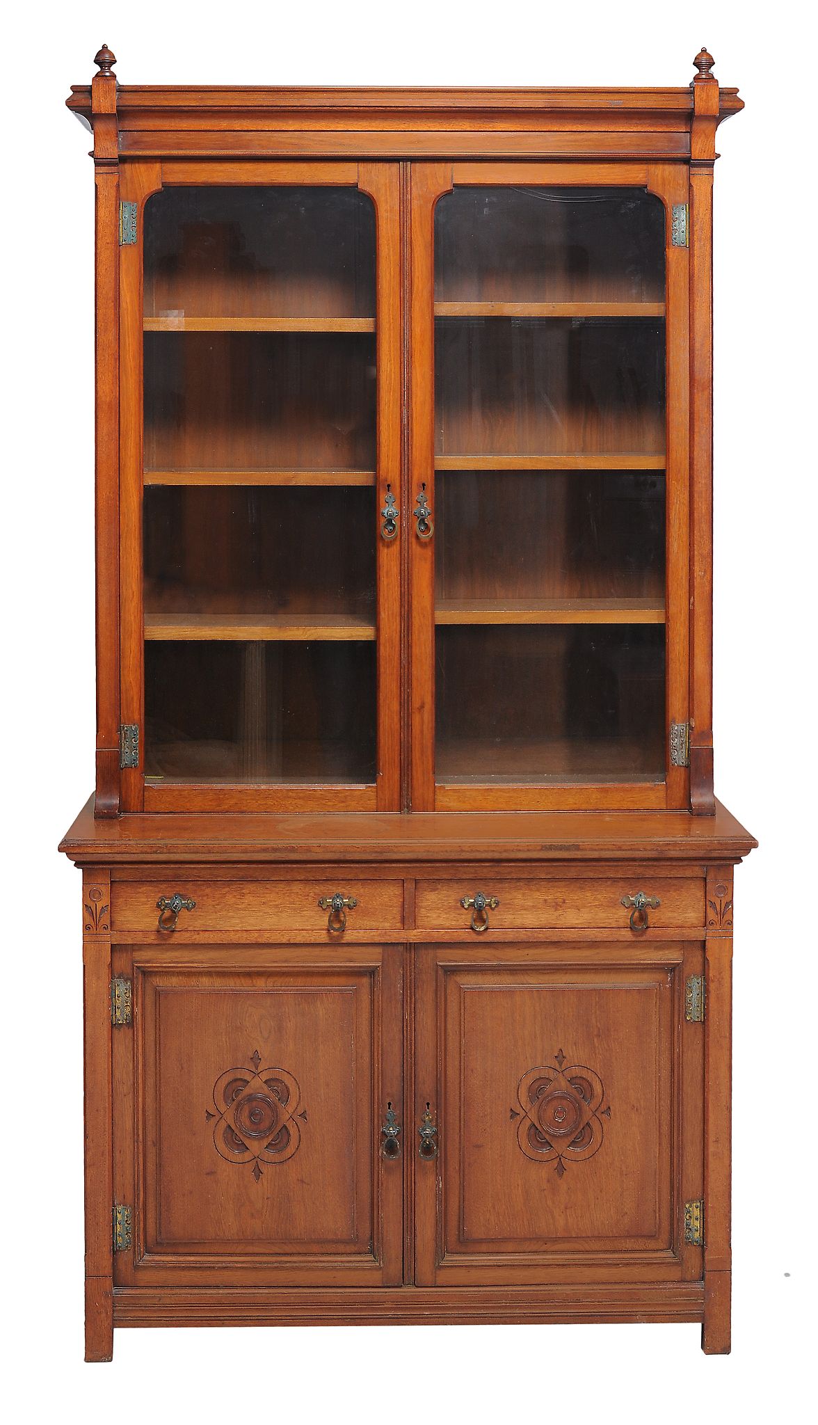 An Arts and Crafts walnut bookcase  , late 19th/ early 20th century, the moulded cornice above two