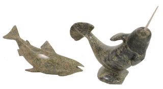 An Inuit carved serpentine and bone model of a narwhal,   unsigned, 35cm high, 43cm long; and a