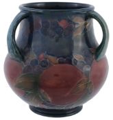 Pomegranate, a Moorcroft three-handled vase,   impressed mark, green painted signature, glue