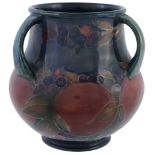 Pomegranate, a Moorcroft three-handled vase,   impressed mark, green painted signature, glue