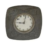 Archibald Knox for Liberty  &  Co., an Arts and Crafts hammered pewter strut clock,   circa 1905,