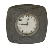 Archibald Knox for Liberty  &  Co., an Arts and Crafts hammered pewter strut clock,   circa 1905,
