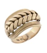 An gold coloured dress ring, with a pierced broad front panel, stamped 18, 17  An gold coloured