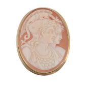 A shell cameo brooch, the oval cameo carved with the profiles of Perseus and...  A shell cameo