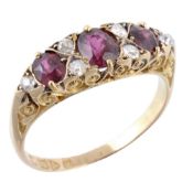 An Edwardian ruby and diamond ring, the three oval shaped rubies between old...  An Edwardian ruby