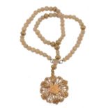 An agate bead and gold coloured metal necklace  An agate bead and gold coloured metal necklace,