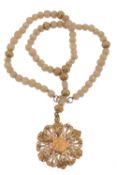 An agate bead and gold coloured metal necklace  An agate bead and gold coloured metal necklace,