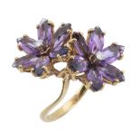 An amethyst flower head ring, the two flower heads set with marquise shaped...  An amethyst flower