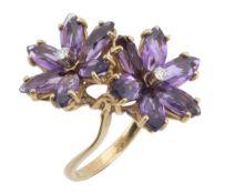 An amethyst flower head ring, the two flower heads set with marquise shaped...  An amethyst flower