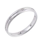 A platinum and diamond ring, the band set with brilliant cut diamonds  A platinum and diamond ring,