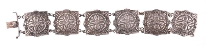 A silver coloured six panel bracelet by Liberty & Co  A silver coloured six panel bracelet by