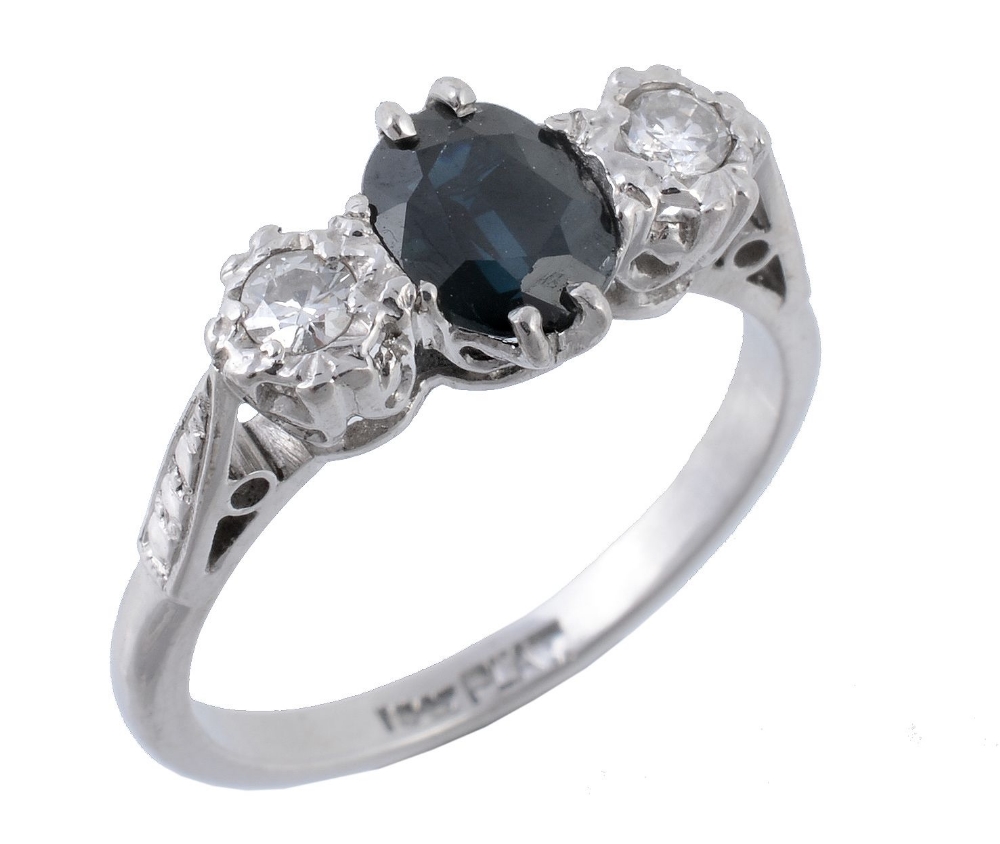 A sapphire and diamond ring, the central oval shaped sapphires claw sett...  A sapphire and