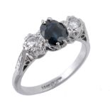 A sapphire and diamond ring, the central oval shaped sapphires claw sett...  A sapphire and