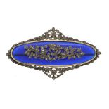 A blue paste and diamond brooch, the oval blue paste panel with applied...  A blue paste and diamond