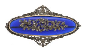 A blue paste and diamond brooch, the oval blue paste panel with applied...  A blue paste and diamond