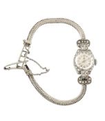 Lotos, a 14 carat white gold and diamond lady's cocktail bracelet watch  Lotos, a 14 carat white