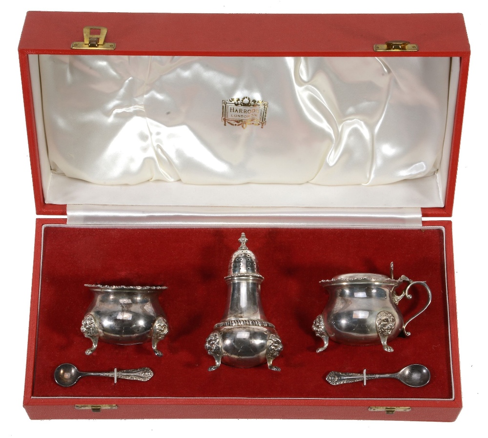 A cased silver three piece baluster condiment set retailed by Harrods Ltd  A cased silver three