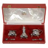 A cased silver three piece baluster condiment set retailed by Harrods Ltd  A cased silver three