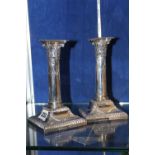 A pair of Edwardian silver square short candlesticks by Lee & Wigfull  A pair of Edwardian silver