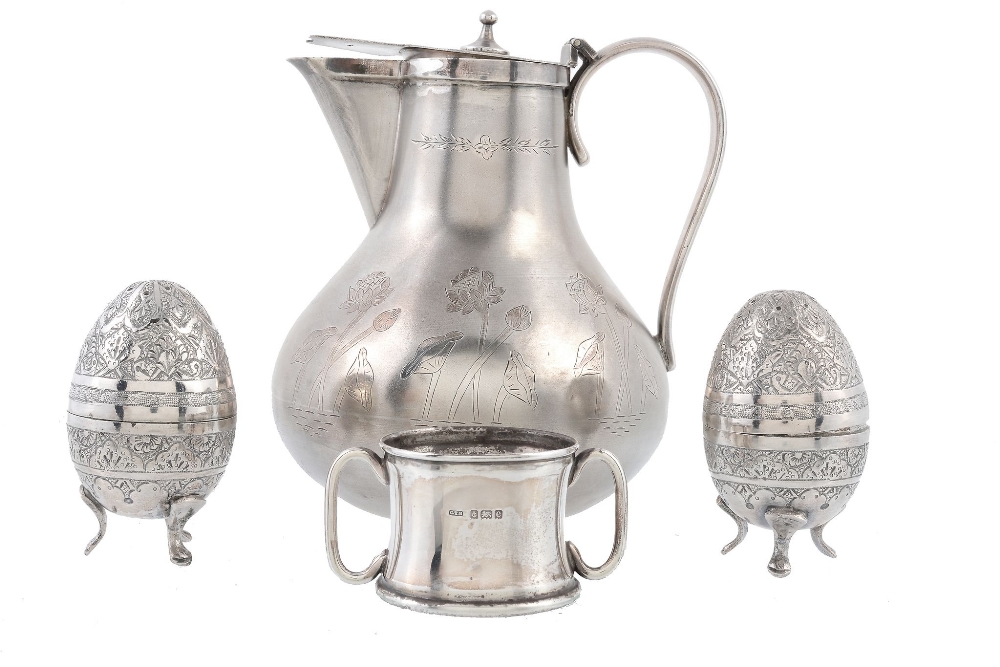 A silver coloured covered jug, indistinct stamped mark  A silver coloured covered jug,