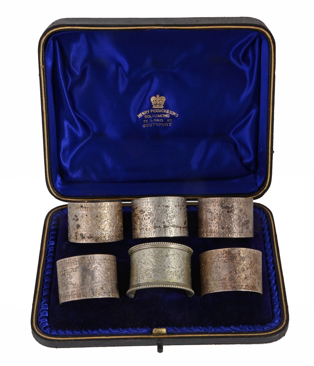 A late Victorian cased set of five silver napkin rings by Josiah Williams & Co  A late Victorian