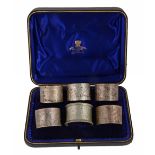 A late Victorian cased set of five silver napkin rings by Josiah Williams & Co  A late Victorian