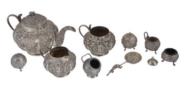 An Indian silver coloured three piece lobed circular tea service , unmarked  An Indian silver