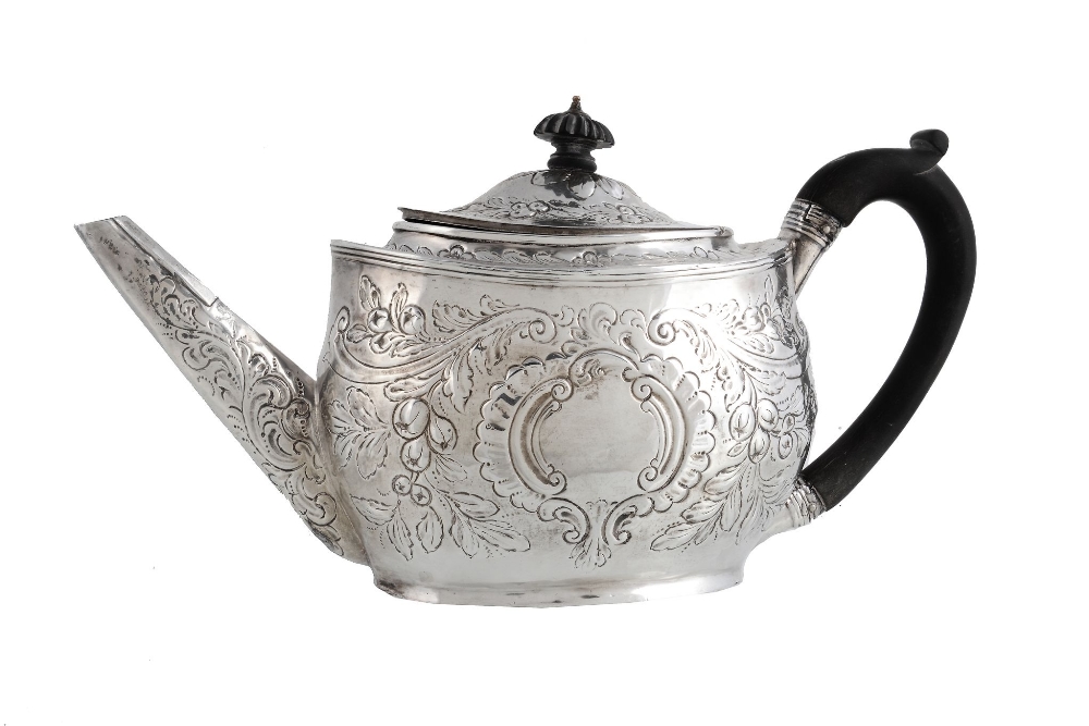 A George III silver later decorated oval tea pot by Solomon Hougham  A George III silver later