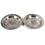 Two 19th century silver plates, unmarked, probably South American  Two 19th century silver plates,
