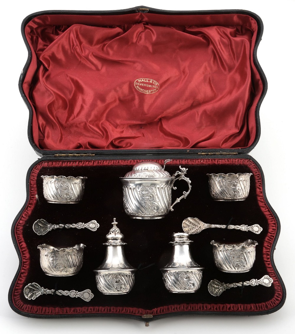 A cased late Victorian silver seven piece cruet set by Charles Edwards  A cased late Victorian