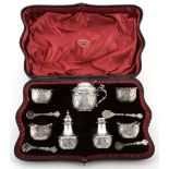 A cased late Victorian silver seven piece cruet set by Charles Edwards  A cased late Victorian