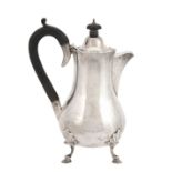A silver baluster hot water jug by Goldsmiths & Silversmiths Co. Ltd  A silver baluster hot water
