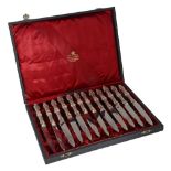 A cased set of twelve German silver coloured fruit knives, post 1886  A cased set of twelve German