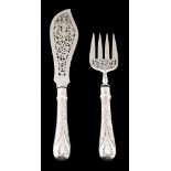 A pair of Victorian silver Newton pattern fish servers by George W  A pair of Victorian silver