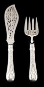 A pair of Victorian silver Newton pattern fish servers by George W  A pair of Victorian silver