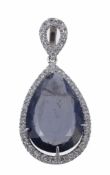An iolite and diamond pendant, the pear shaped iolite in a claw setting...  An iolite and diamond