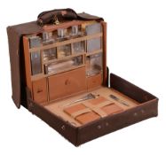 A pigskin rectangular travelling case with silver fittings by Asprey & Co  A pigskin rectangular