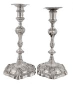 A matched pair of George III cast silver hexagonal candlesticks  A matched pair of George III cast