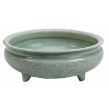 A Longquan celadon censer, Ming dynasty, of typical circular form raised on...  A Longquan celadon