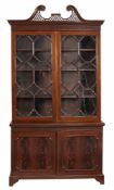 A mahogany cabinet bookcase , in George III style  A mahogany cabinet bookcase  , in George III